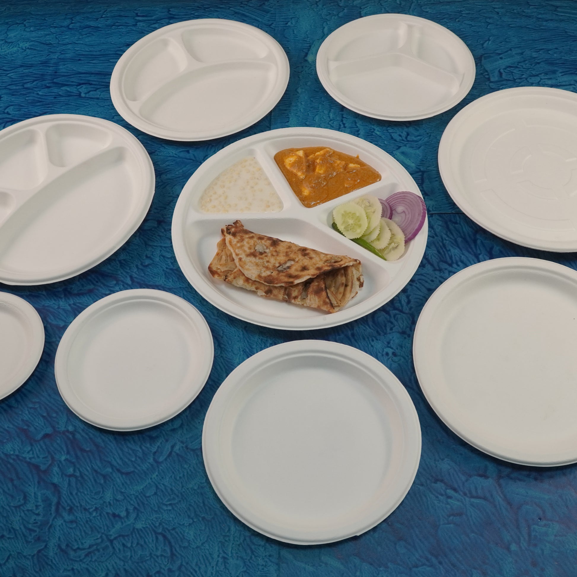 Eco-friendly disposable tableware sample kit with plates, cups, and cutlery